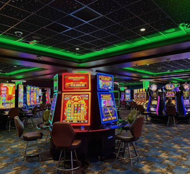 Star ceiling panels installed over slot machines in a casino gaming area