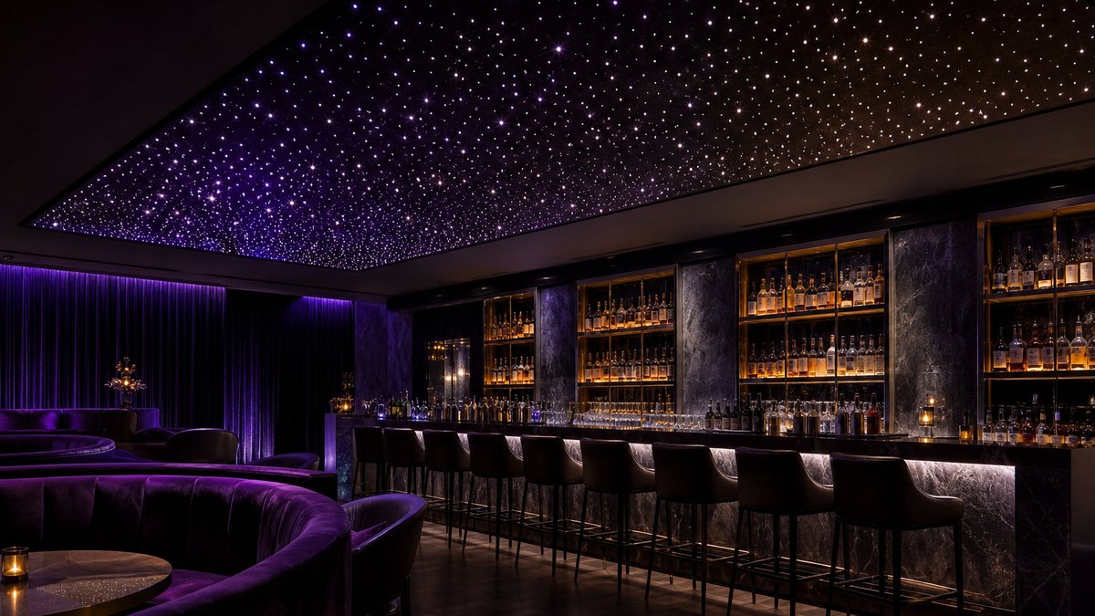 Commercial star ceiling in a dark cocktail lounge with a fiber optic star field glowing above the bar and velvet booths