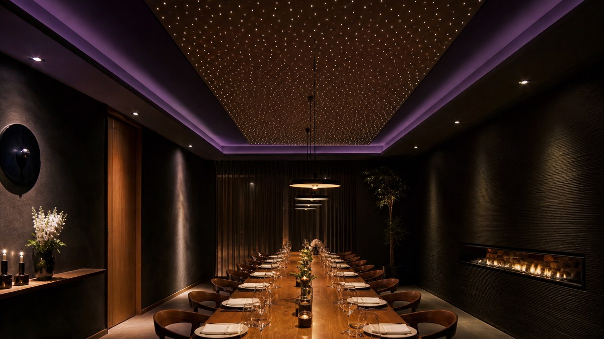 Restaurant star ceiling with warm white fiber optic stars centered over a private dining room with set tables and soft pendant lights